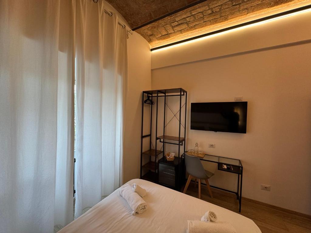 Postel nebo postele na pokoji v ubytování Hotel Felice