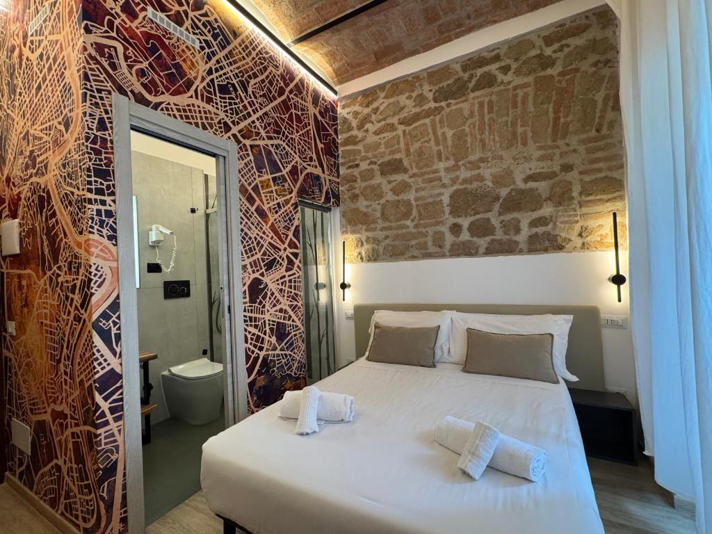 Postel nebo postele na pokoji v ubytování Hotel Felice