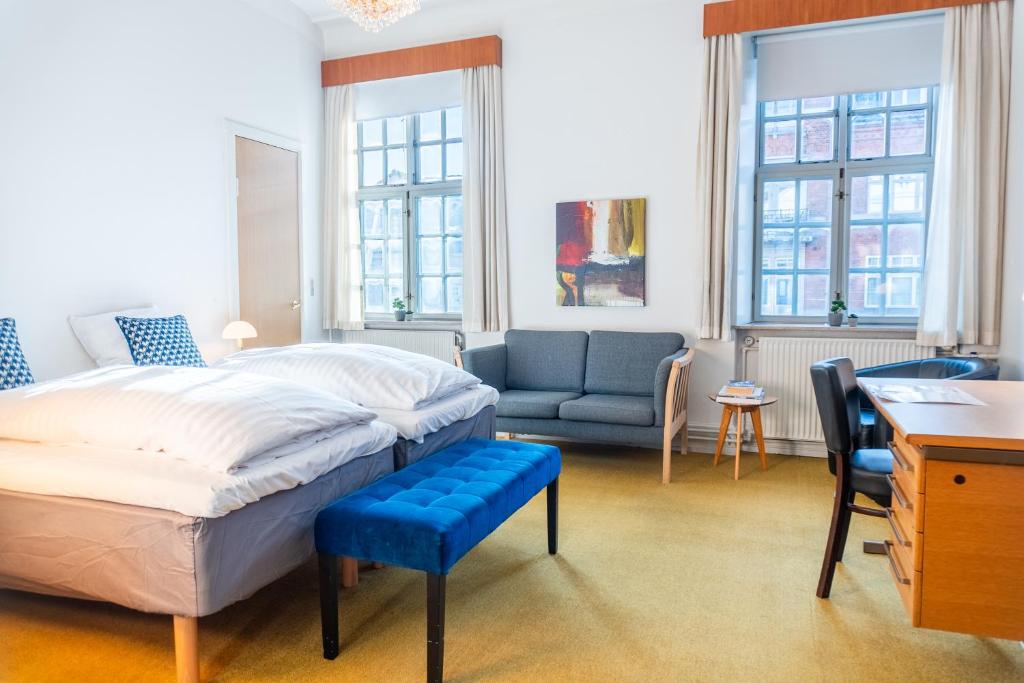 Postel nebo postele na pokoji v ubytování Cityinn Hotel