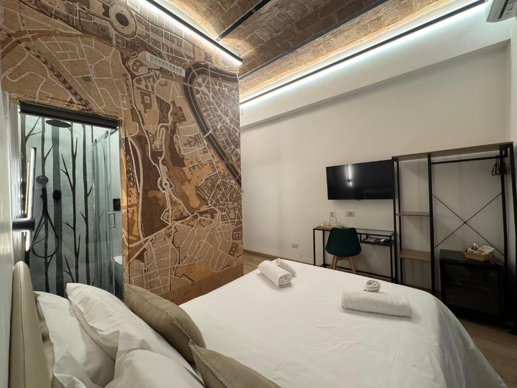 Postel nebo postele na pokoji v ubytování Hotel Felice