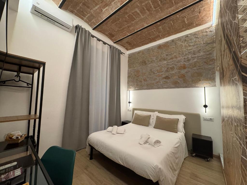 Postel nebo postele na pokoji v ubytování Hotel Felice