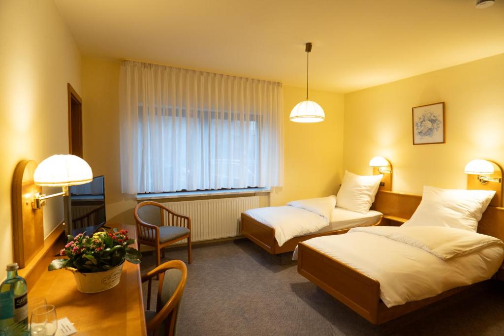 Postel nebo postele na pokoji v ubytování Hotel Liederbacher Hof