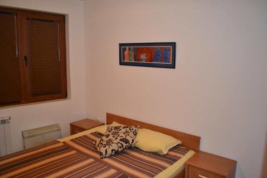 A bed or beds in a room at Bulhotel Pritzker Apartment