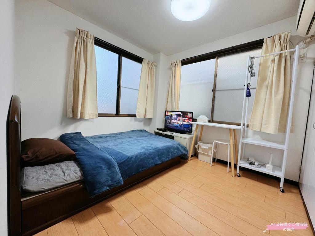 Postel nebo postele na pokoji v ubytování Kawaguchi house