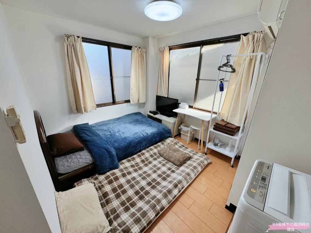 Postel nebo postele na pokoji v ubytování Kawaguchi house
