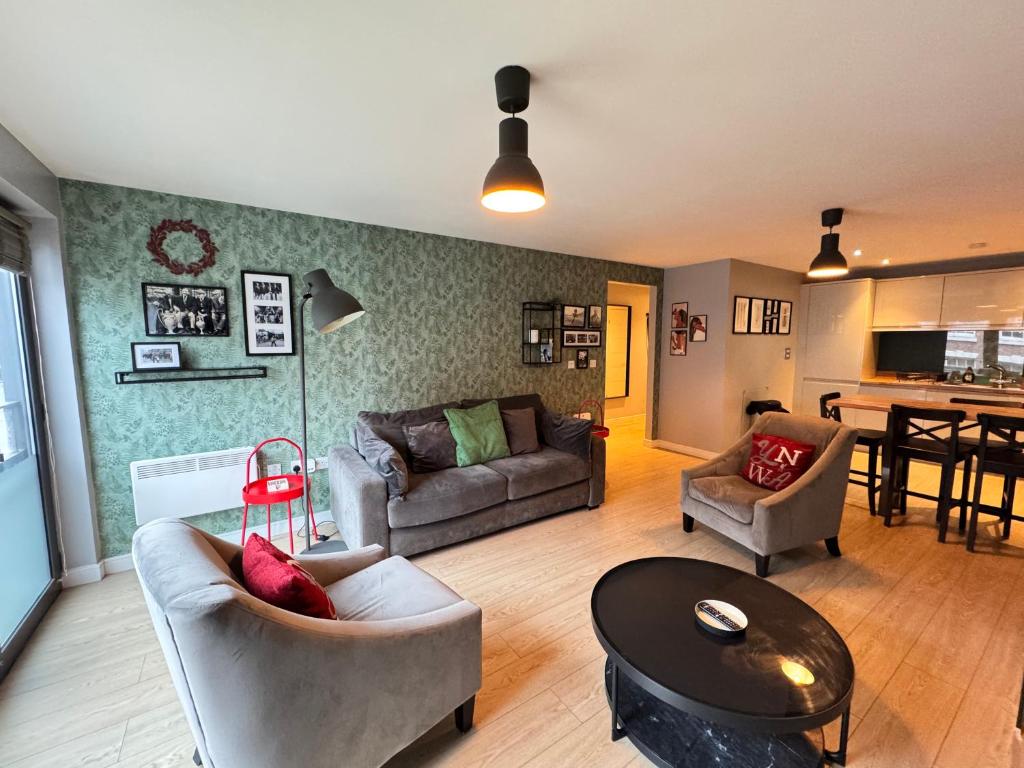 a living room with a couch and a table at Centrally located apartment in Duke Street- free parking- two bathrooms in Liverpool