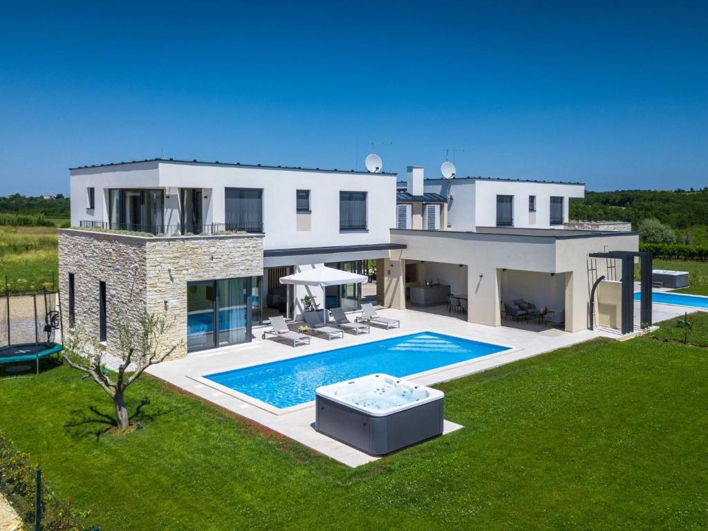 an image of a house with a swimming pool at Villa Bella & Chiara by Interhome in Brtonigla