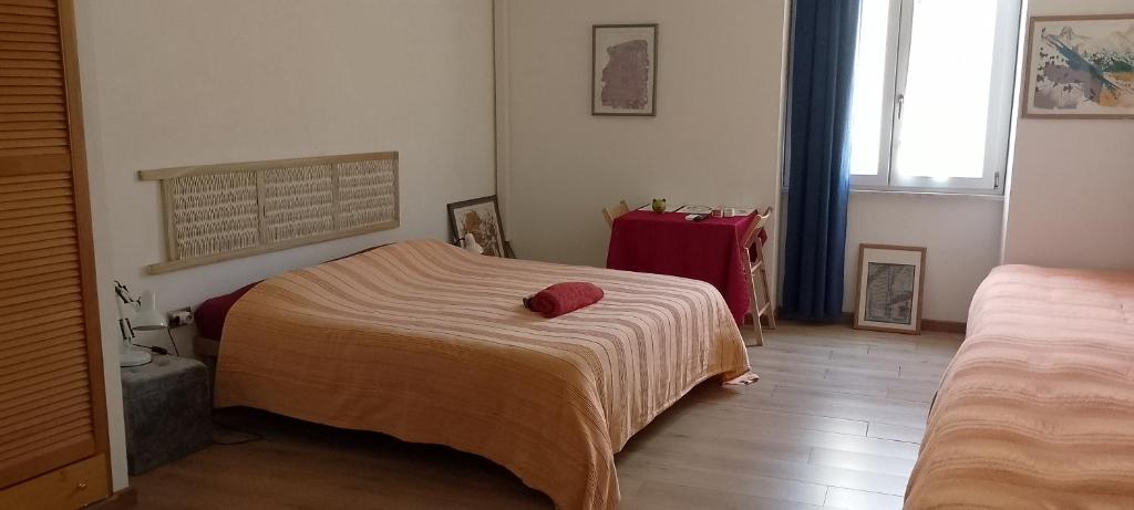 a bedroom with a bed with a blanket on it at Torre Tonda in Sassari