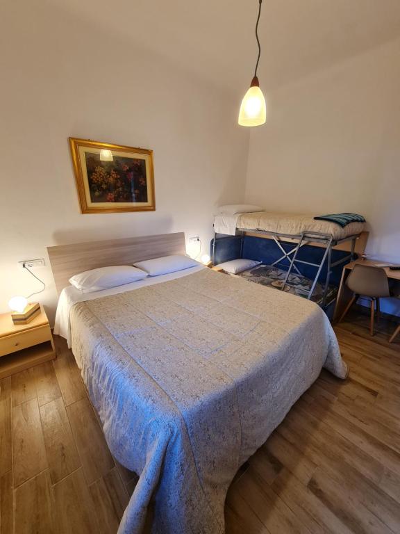 Postel nebo postele na pokoji v ubytování Albergo Genio