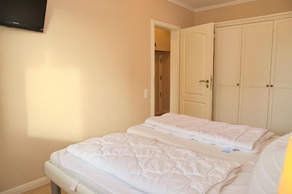 Postel nebo postele na pokoji v ubytování Hanseat II App 137