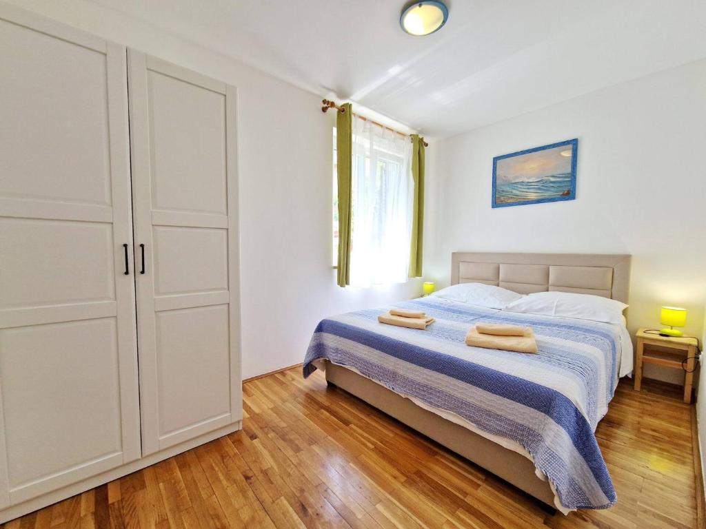 Posteľ alebo postele v izbe v ubytovaní Apartment Sersic