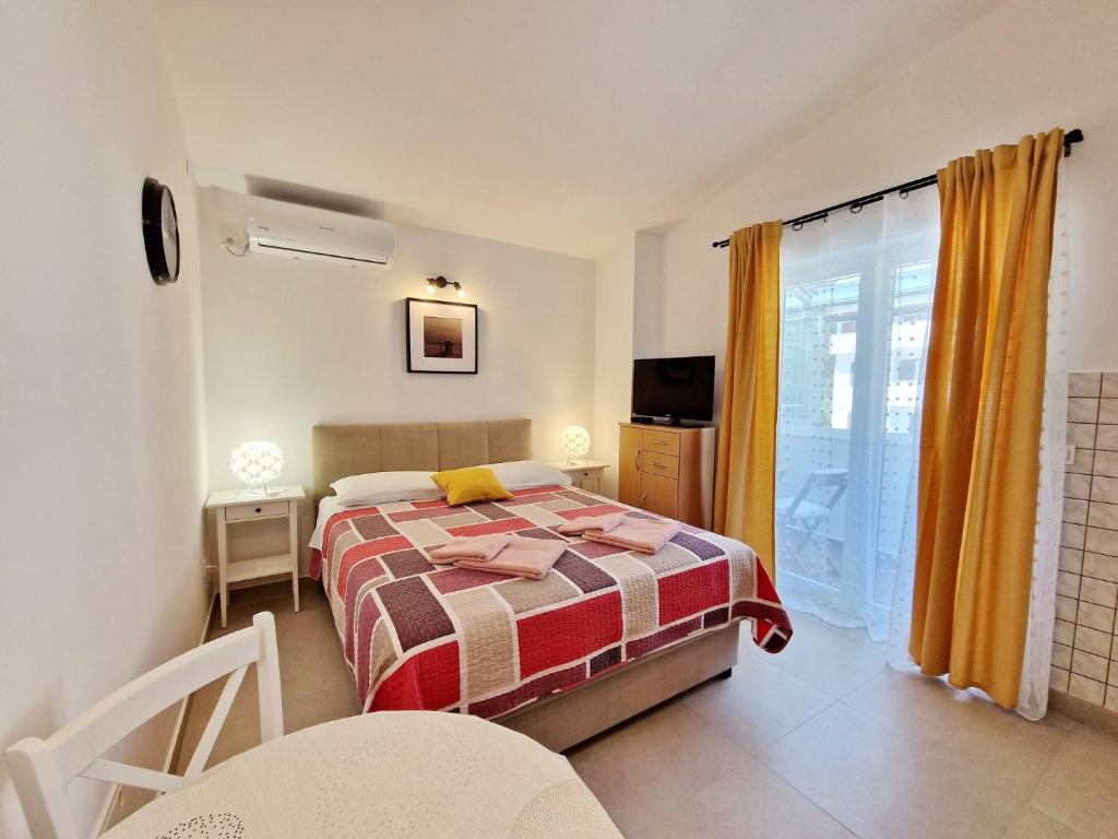 Posteľ alebo postele v izbe v ubytovaní Apartment Sersic