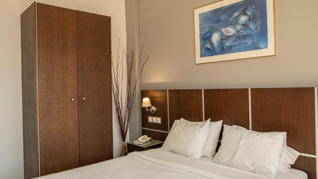 Postel nebo postele na pokoji v ubytování Blue Sea Hotel Alimos