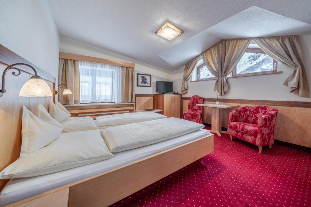 Postel nebo postele na pokoji v ubytování Hotel Regina