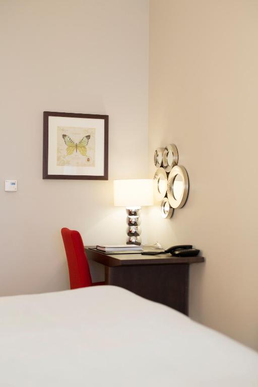 Postel nebo postele na pokoji v ubytování Elite Hotel Adlon