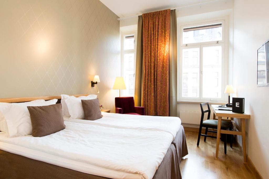 Postel nebo postele na pokoji v ubytování Elite Hotel Adlon