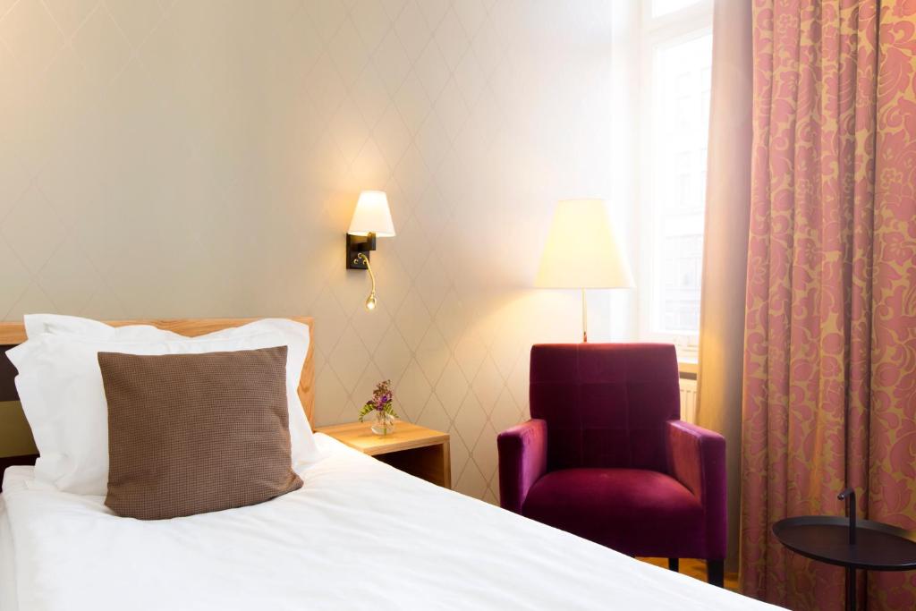 Postel nebo postele na pokoji v ubytování Elite Hotel Adlon