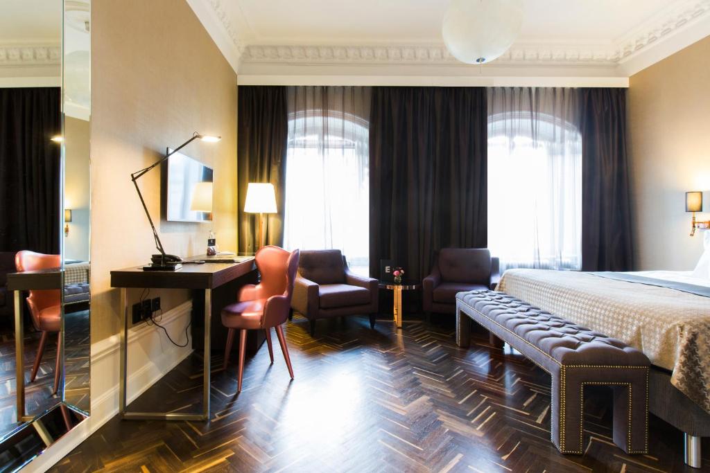 Postel nebo postele na pokoji v ubytování Elite Hotel Adlon