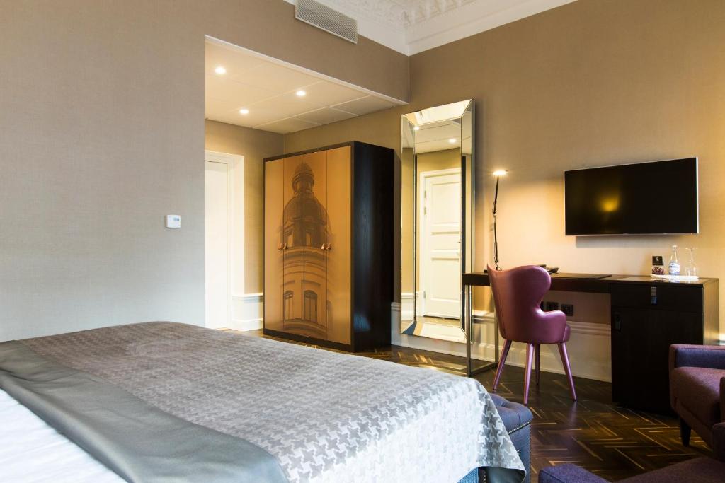 Postel nebo postele na pokoji v ubytování Elite Hotel Adlon