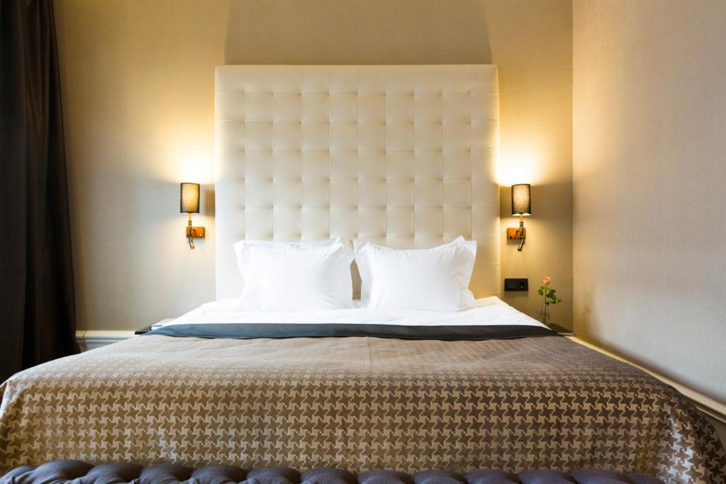 Postel nebo postele na pokoji v ubytování Elite Hotel Adlon