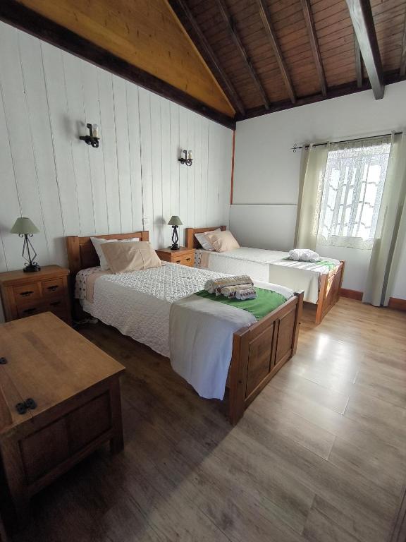 Postel nebo postele na pokoji v ubytování Casal do Vulcão