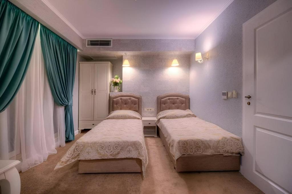 Postel nebo postele na pokoji v ubytování Family Hotel Agoncev