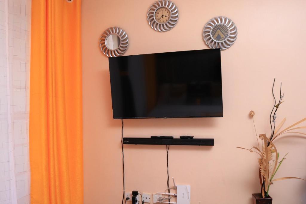 TV a/nebo společenská místnost v ubytování budget bliss ruaka