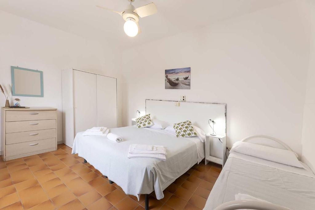 Postel nebo postele na pokoji v ubytování Hotel Le Ghiaie
