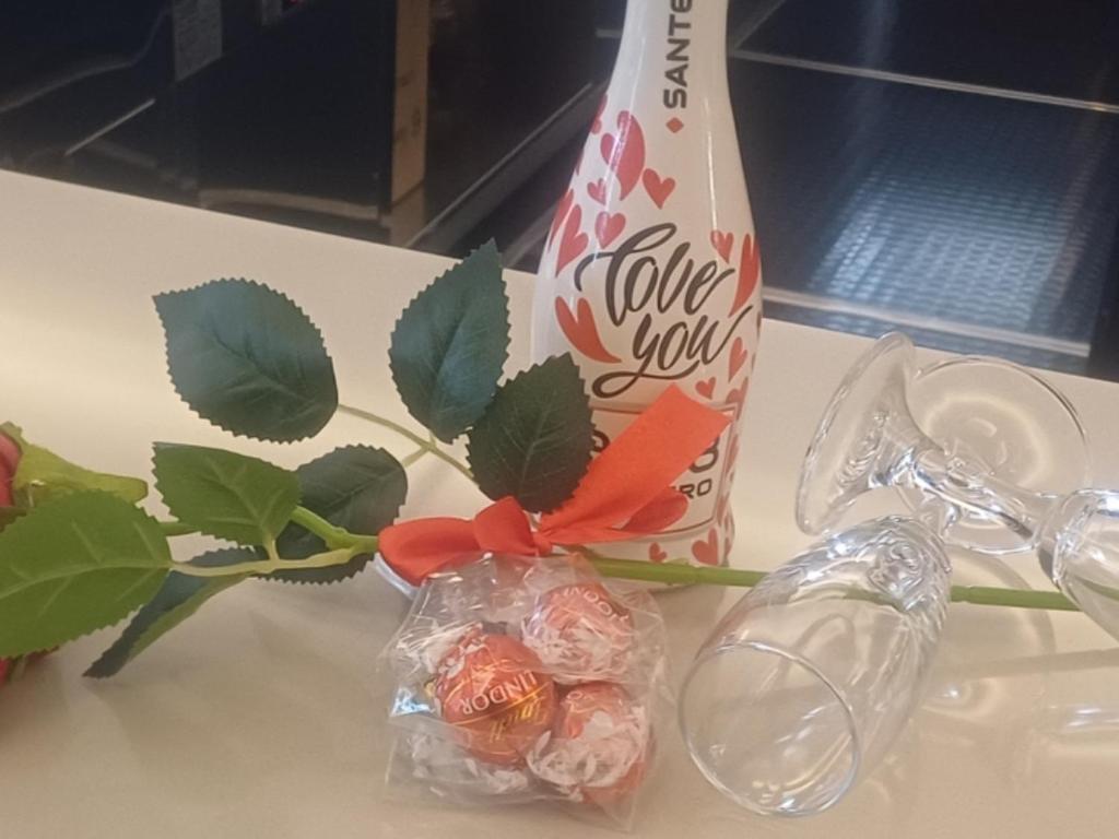 a bottle oflove you and a bag of candy at Martini Matera 2-luxury apartment in Matera