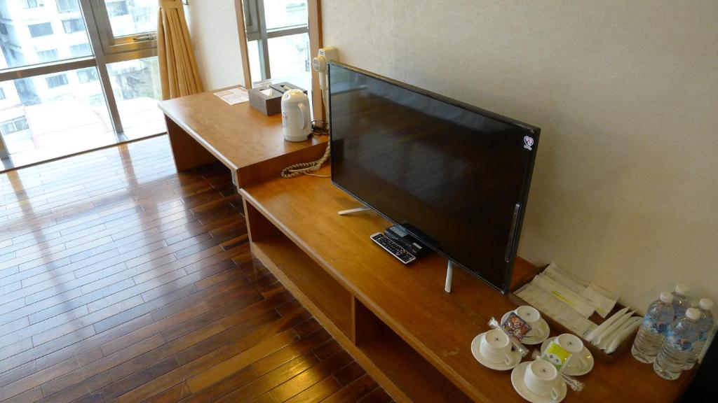TV a/nebo společenská místnost v ubytování Lishin Hotel
