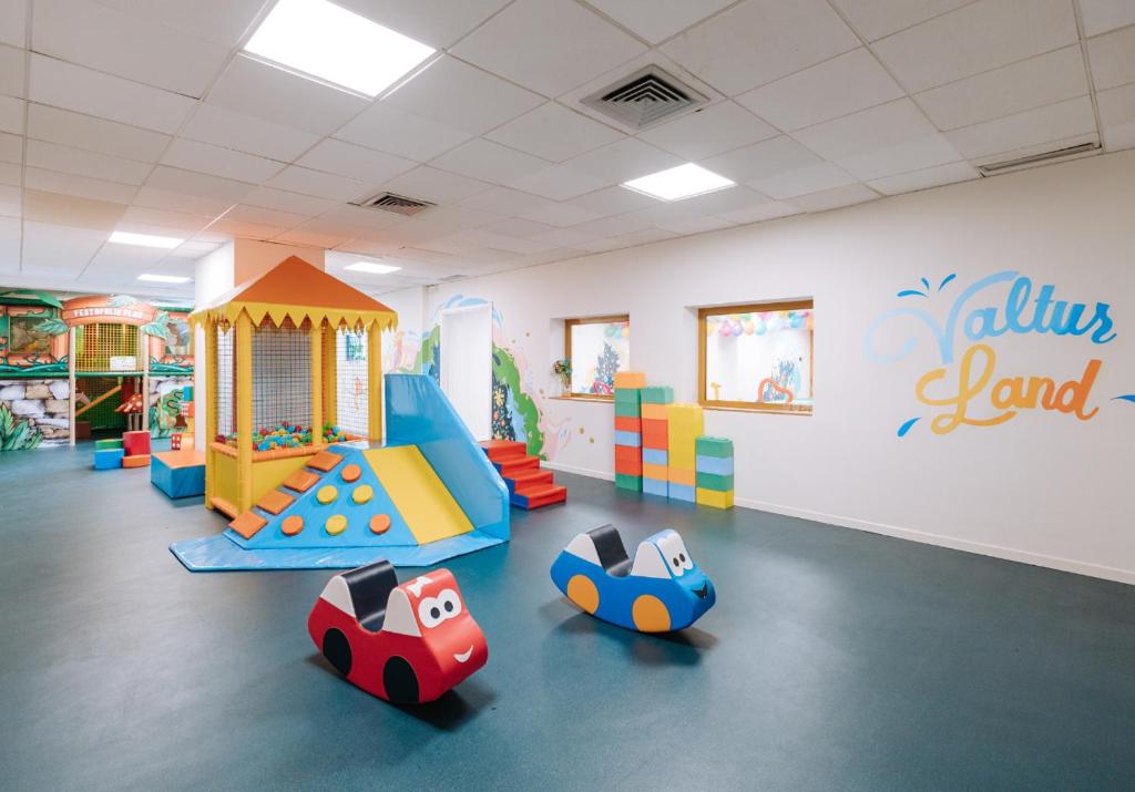 a childrens play area with toys in a room at Valtur Cervinia Cristallo Ski Resort in Breuil-Cervinia