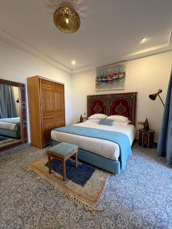 Postel nebo postele na pokoji v ubytování Riad Mellah