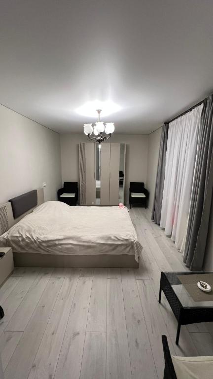 Postel nebo postele na pokoji v ubytování Cozy Apartment
