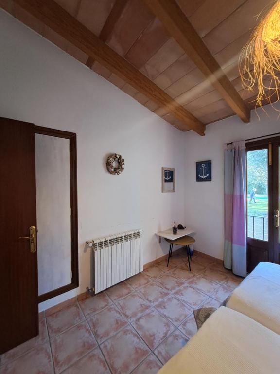 A bed or beds in a room at Es garballons