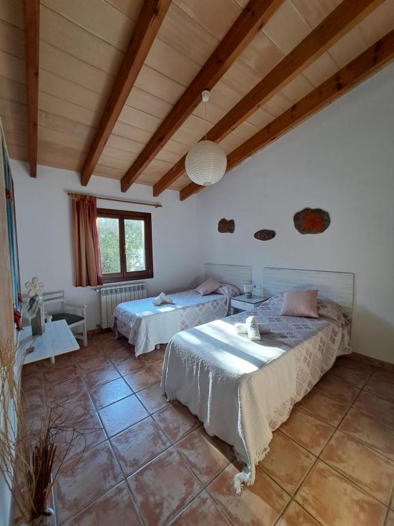 A bed or beds in a room at Es garballons