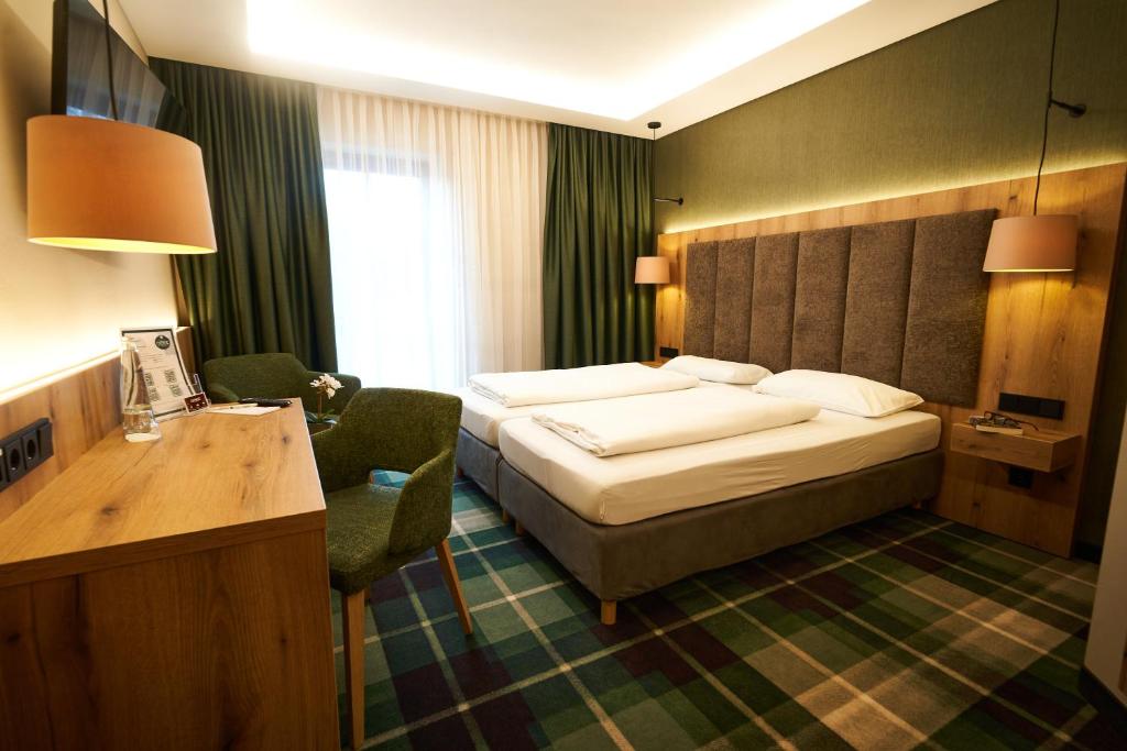 Postel nebo postele na pokoji v ubytování Hotel Restaurant Erber