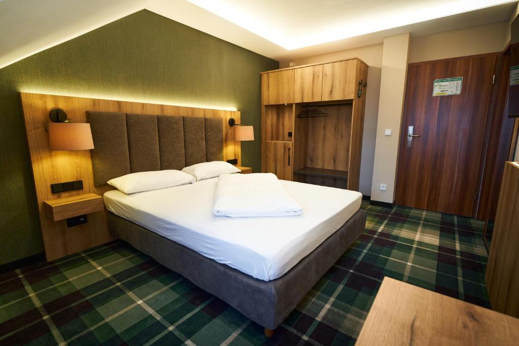 Postel nebo postele na pokoji v ubytování Hotel Restaurant Erber