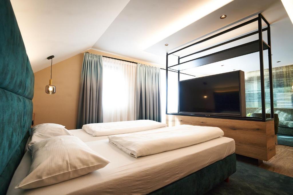 Postel nebo postele na pokoji v ubytování Hotel Restaurant Erber