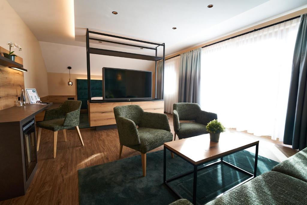 TV a/nebo společenská místnost v ubytování Hotel Restaurant Erber