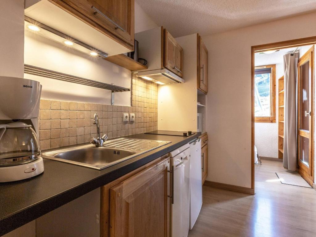 a kitchen with a sink and a counter top at Studio cabine 5 personnes avec balcon - La Plagne - FR-1-353-85 in Les Coches