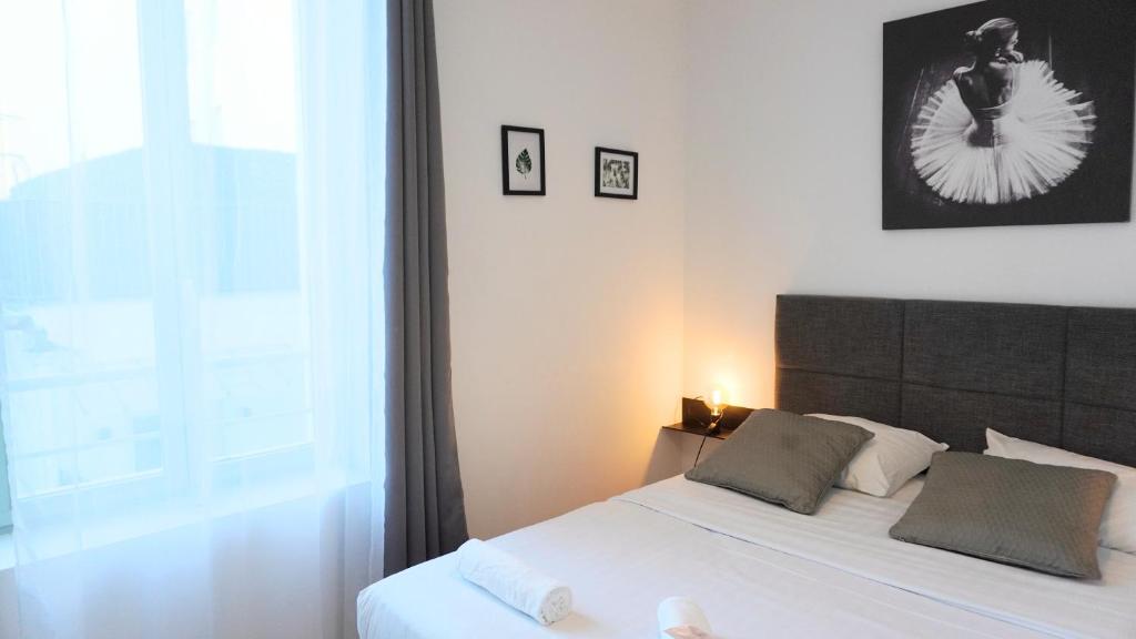 Posteľ alebo postele v izbe v ubytovaní Proche Carlton & Croisette, Appartement 101 - Palmazur Vacances