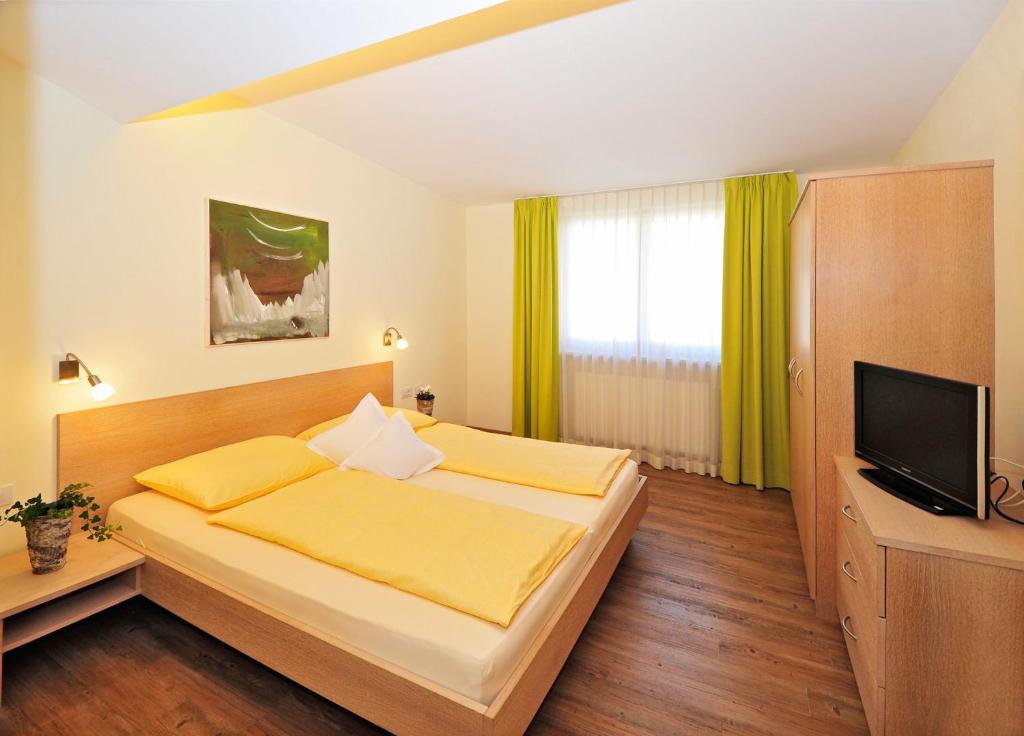 Postel nebo postele na pokoji v ubytování Residence Mignon