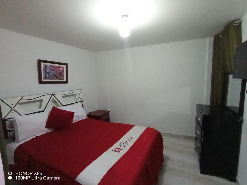 Postel nebo postele na pokoji v ubytování Hotel D'Gloria