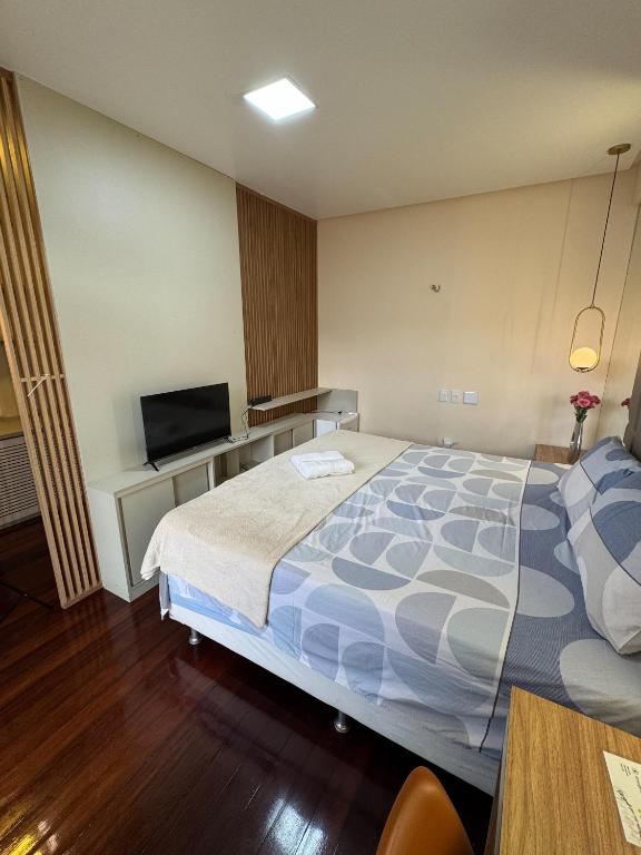 Postel nebo postele na pokoji v ubytování Casa Rosa Suítes 5 min de caminhada da PRAIA DA PONTA NGRA