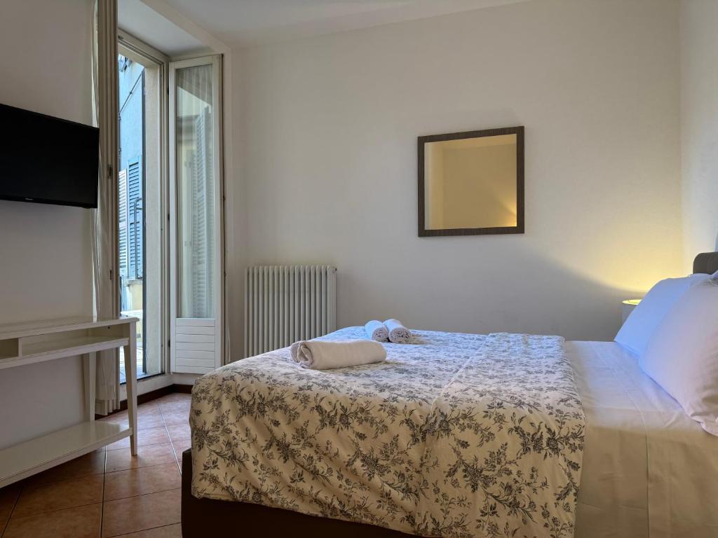 A bed or beds in a room at Casa al Lago