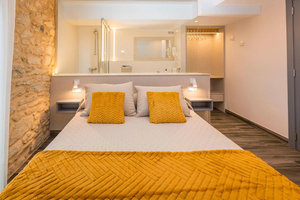 Posteľ alebo postele v izbe v ubytovaní Apartamentos Currás en Touriñán