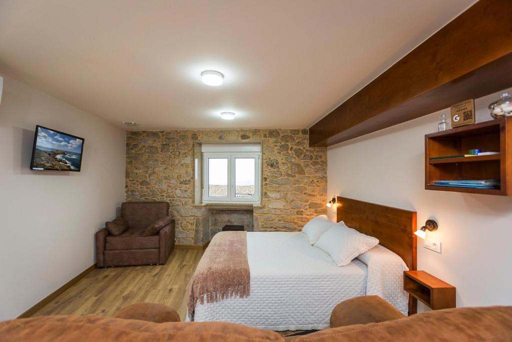 Posteľ alebo postele v izbe v ubytovaní Apartamentos Currás en Touriñán