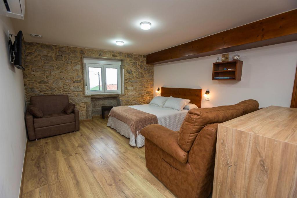 Posteľ alebo postele v izbe v ubytovaní Apartamentos Currás en Touriñán