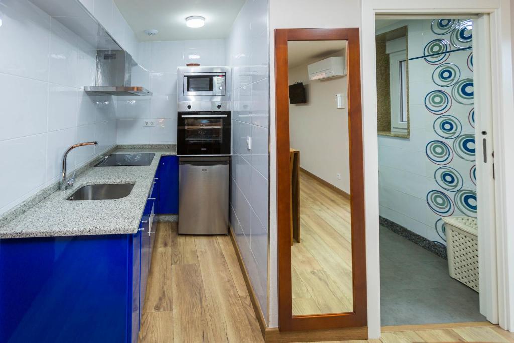 Kuchyňa alebo kuchynka v ubytovaní Apartamentos Currás en Touriñán