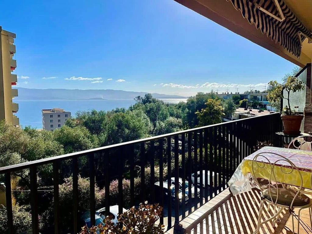 a balcony with a view of the water at Casamea - Spacieux T3 famille, Vue mer, Parking in Ajaccio